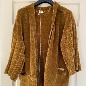Anthropologie cardigan in a rich mustard hue